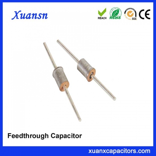 Welded ceramic feedthrough capacitor